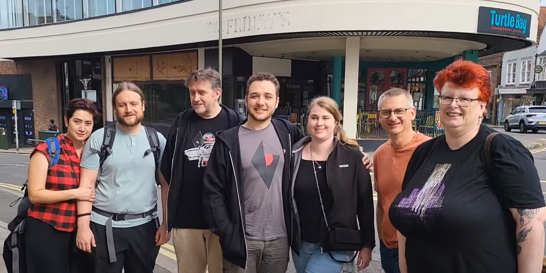 Group of attendees that delivered the HelloGames gift the next day