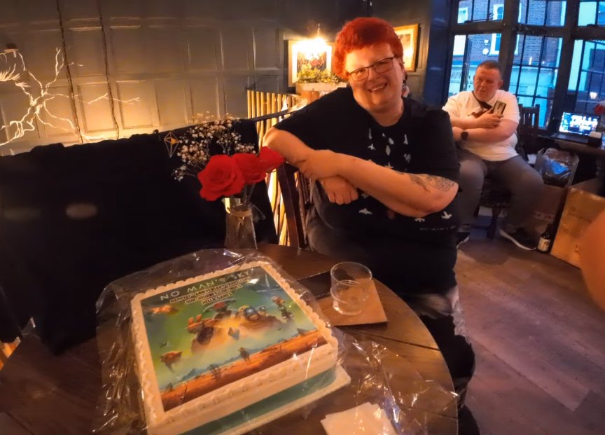 Nella with the cake provided by HelloGames